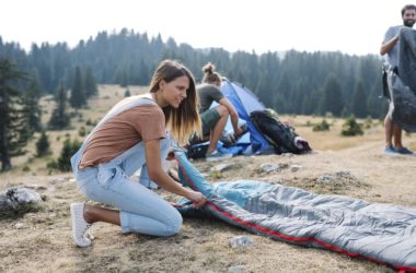 girl setting up camp